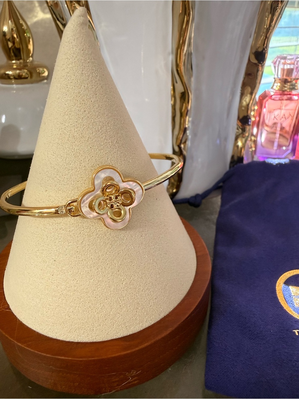 Tory Burch Gold Logo Flower Bangle with White Enamel Accents
